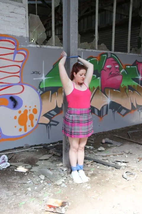 Curvy Redhead MILF Bound to a Post in Her Skirt – photo 3 of 16