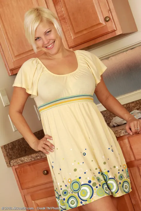 Kelly L: Busty Blonde MILF Strips Out of Her Skirt in the Kitchen – photo 1 of 15