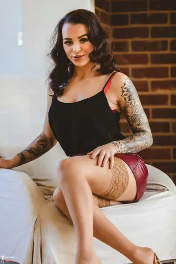 Tattooed Brunette Strips Out of Her Lingerie and Skirt