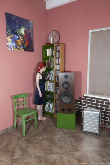 Redhead in a Skirt Lifts Arms and Fingers Her Hairy Muff