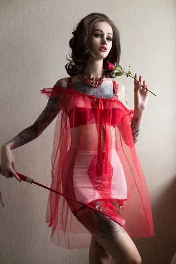 Pale Redhead Strips Out of Her Lingerie and Poses in Costumes