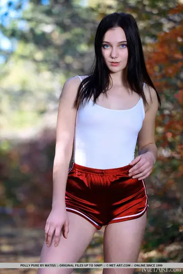 Skinny Brunette Strips Out of Her Shorts on a Yoga Mat in the Woods