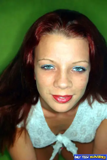 Slim Redhead with Big Enhanced Tits Gives a Blowjob and Takes a Facial