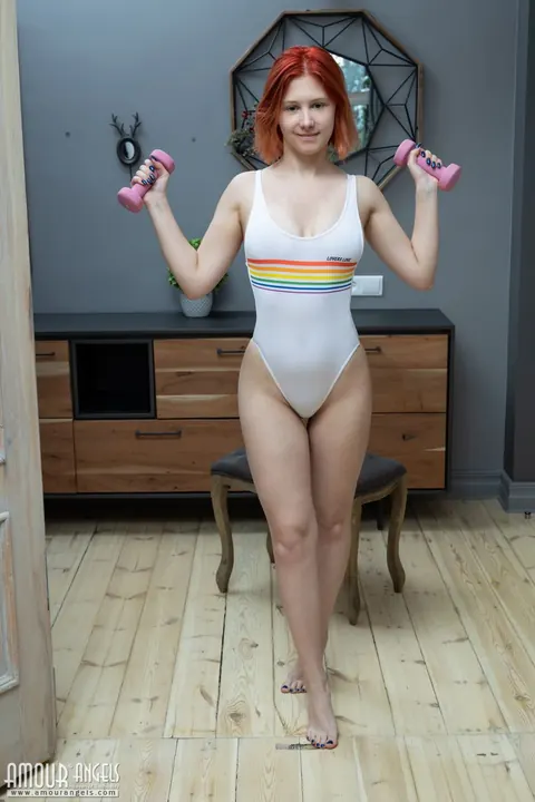 Redhead Pulls Bikini Aside and Spreads Her Shaved Pussy – photo 1 of 20