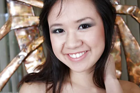 Carmina Kai: Petite Asian Brunette Flashes Her Breasts and Spreads Her Shaved Pussy – photo 11 of 16
