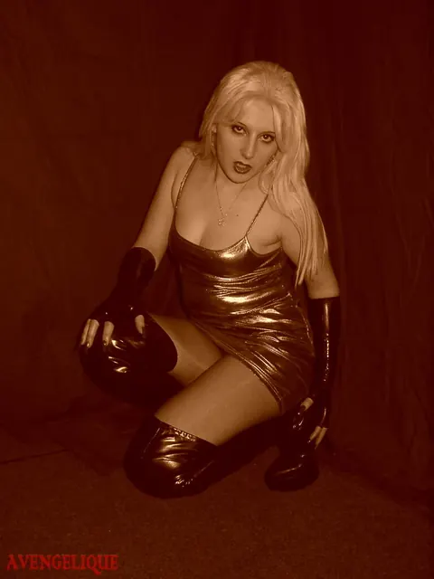 Blonde Unzips Her Latex Dress and Frees Big Tits – photo 2 of 16
