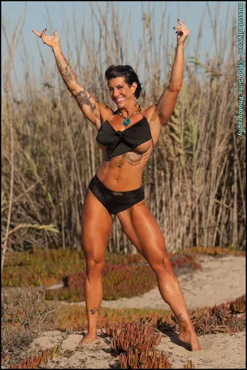 Tattooed Brunette Bodybuilder Strips Out of Her Bikini Outdoors