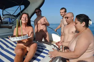 Brunette Gives a Blowjob and Takes a Cumshot on a Boat