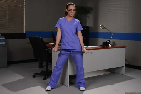 Maddy OReilly: Redhead Nurse Strips Out of Her Uniform in Glasses – photo 4 of 20