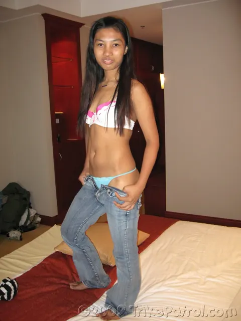 Asian Woman Strips and Fingers Her Pussy in a Hotel – photo 6 of 17