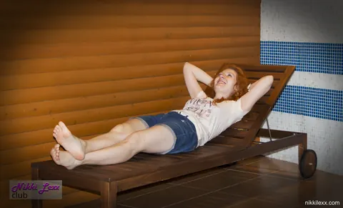 Busty Redhead MILF Strips Out of Her Shorts by the Pool – photo 6 of 16