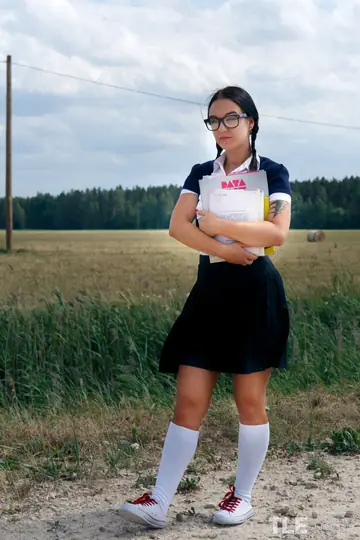 Brunette in Glasses Masturbates with a Dildo in Her Skirt