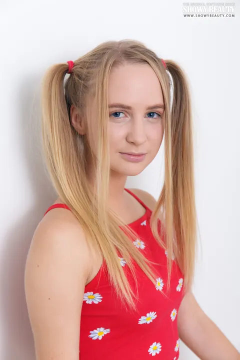 Blonde in Shorts Spreads with Long Pigtails – photo 1 of 20