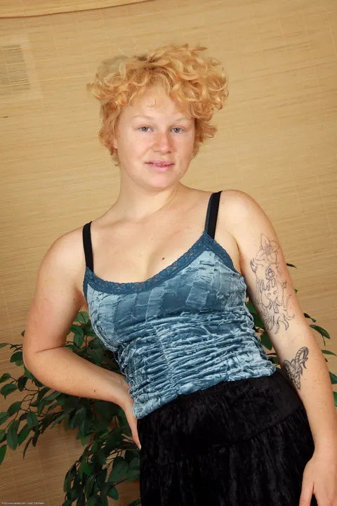 Pale Redhead MILF with Big Tits Undresses and Spreads – photo 1 of 21