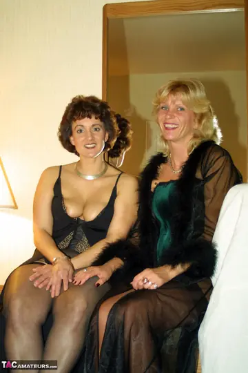 Thick Blonde MILFs in Stockings Kiss in a Motel Room