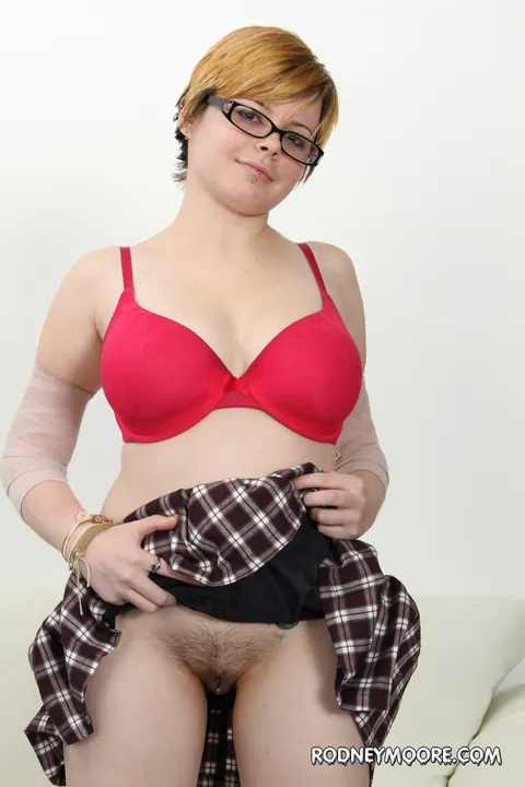 Short-Haired Woman in a Skirt and Glasses Strips and Spreads – photo 9 of 16
