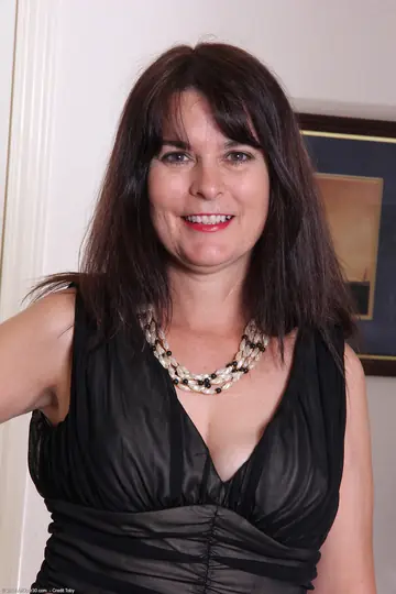 Brunette MILF in Lingerie and Skirt Shows Her Body