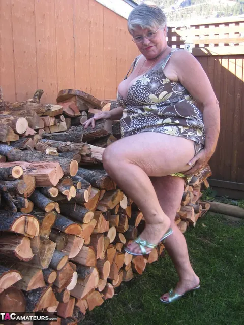 European BBW Strips by a Wood Pile Outdoors – photo 6 of 20