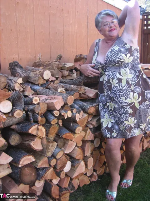 European BBW Strips by a Wood Pile Outdoors – photo 2 of 20