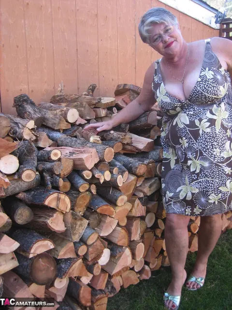 European BBW Strips by a Wood Pile Outdoors – photo 1 of 20
