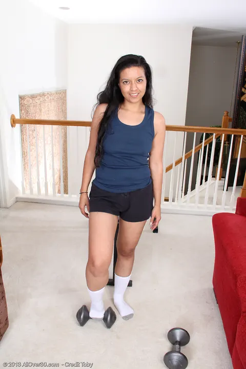 Julie Ann: Skinny MILF Strips Out of Her Shorts and Socks on Weightlifting Bench – photo 4 of 14