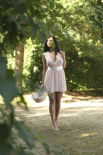 Russian Brunette Picks Fruit Outdoors in a Skirt