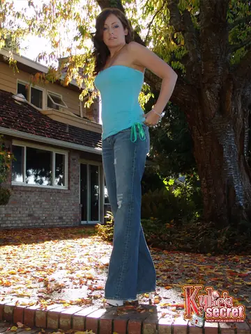 Kylies Secret – Redhead in Jeans Strips Topless Outdoors