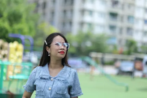 Petite Asian Woman in Glasses Poses Outdoors – photo 15 of 21