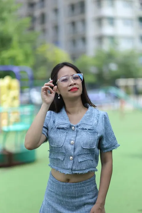 Petite Asian Woman in Glasses Poses Outdoors – photo 19 of 21