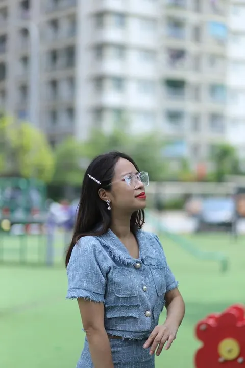 Petite Asian Woman in Glasses Poses Outdoors – photo 4 of 21