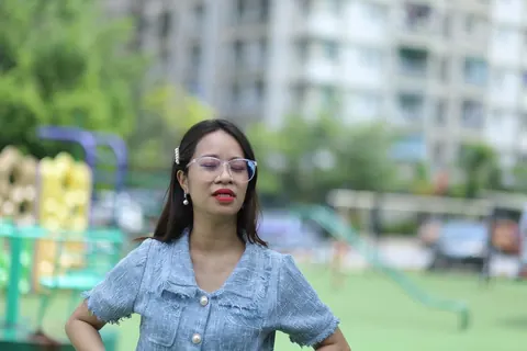 Petite Asian Woman in Glasses Poses Outdoors – photo 16 of 21