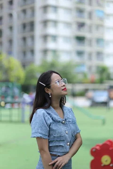 Petite Asian Woman in Glasses Poses Outdoors – photo 5 of 21