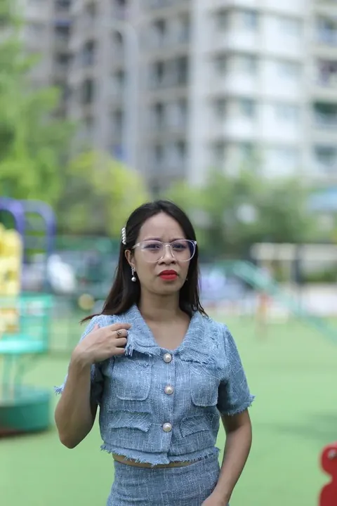 Petite Asian Woman in Glasses Poses Outdoors – photo 13 of 21