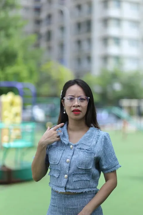 Petite Asian Woman in Glasses Poses Outdoors – photo 12 of 21