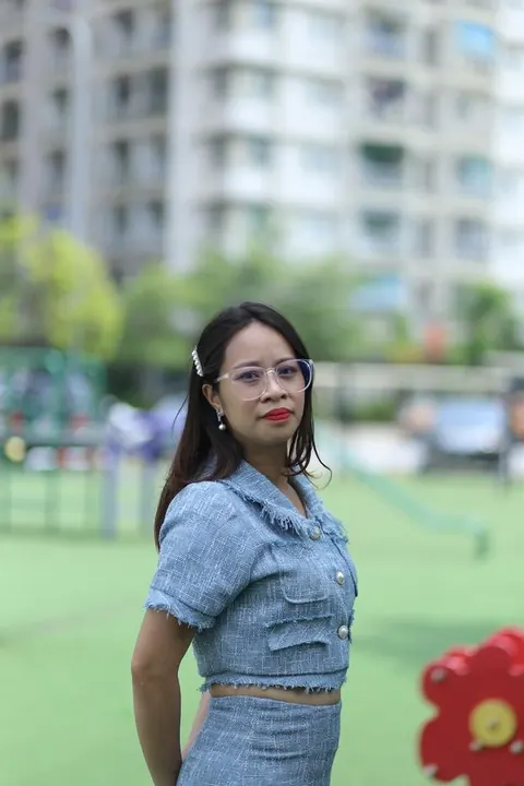Petite Asian Woman in Glasses Poses Outdoors – photo 21 of 21