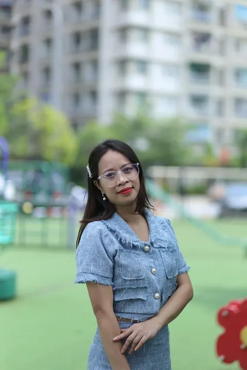 Petite Asian Woman in Glasses Poses Outdoors – photo 7 of 21