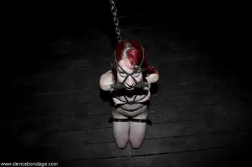 Redhead in Bondage Uses a Dildo and Fingers Herself