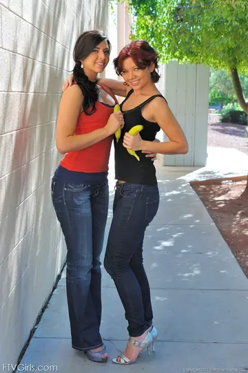 Two Thick Brunettes in Heels Lick Pussy and Fuck Asses with a Banana Outdoors