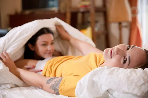 Alya Stark: Brunette Lesbians Lick Hairy Pussies and Facesit in Bed – photo 1 of 16