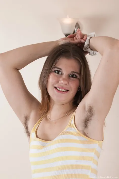Hairy Woman Pulls Aside Her Yoga Pants on the Sofa – photo 2 of 16
