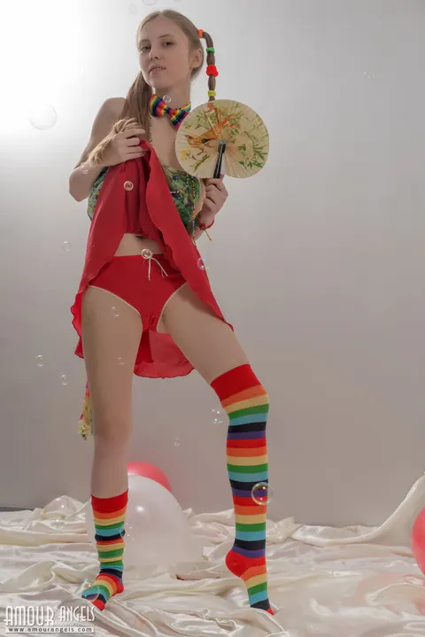 Slim Woman in Rainbow Socks Spreads Her Hairy Pussy – photo 5 of 20