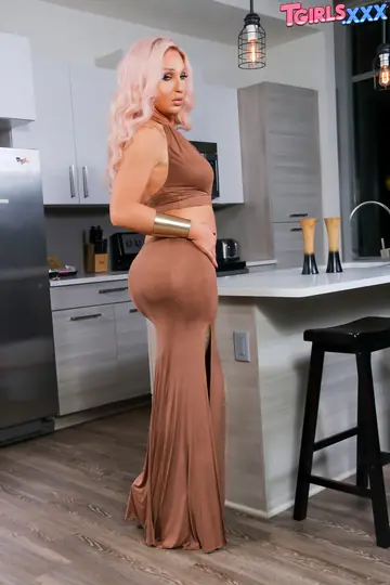 Blonde Trans MILF Lets Her Dress Fall and Poses Nude
