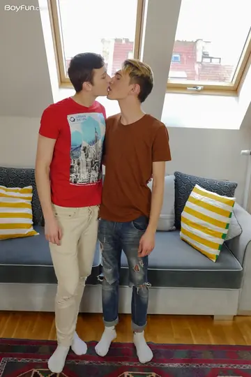 Two Men Kiss and Stroke Each Other's Cocks