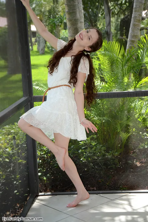 Avri Norwood: Slim Brunette with Big Natural Tits Strips Out of Her Skirt – photo 2 of 16