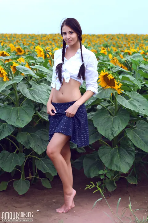 Vanessa Angel: Slim Brunette MILF in Pigtails Spreads Outdoors in Sunflowers – photo 2 of 20