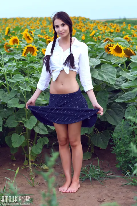 Vanessa Angel: Slim Brunette MILF in Pigtails Spreads Outdoors in Sunflowers – photo 1 of 20