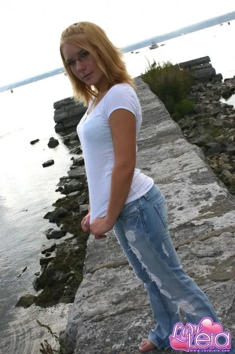 Blonde with Big Tits Strips Out of Her Ripped Jeans on the Beach – photo 1 of 12