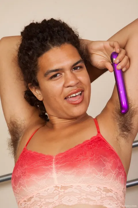 Yonique: Petite Ebony Brunette in Panties Plays with a Purple Toy in Bed – photo 2 of 17