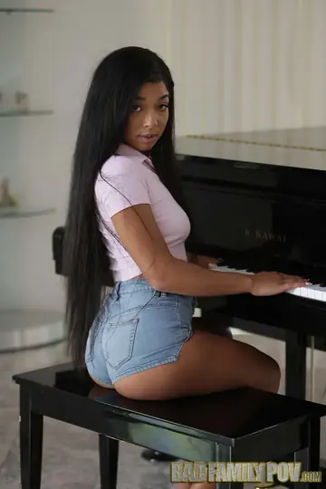 Tall Ebony Brunette Undresses and Spreads at the Piano