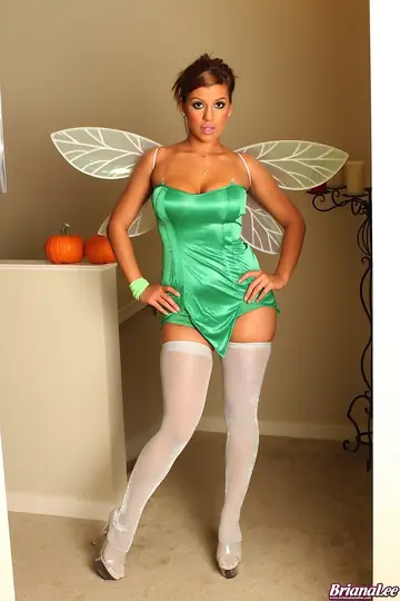 Busty Brunette in Cosplay Costume Spreads Her Legs in Stockings and Heels